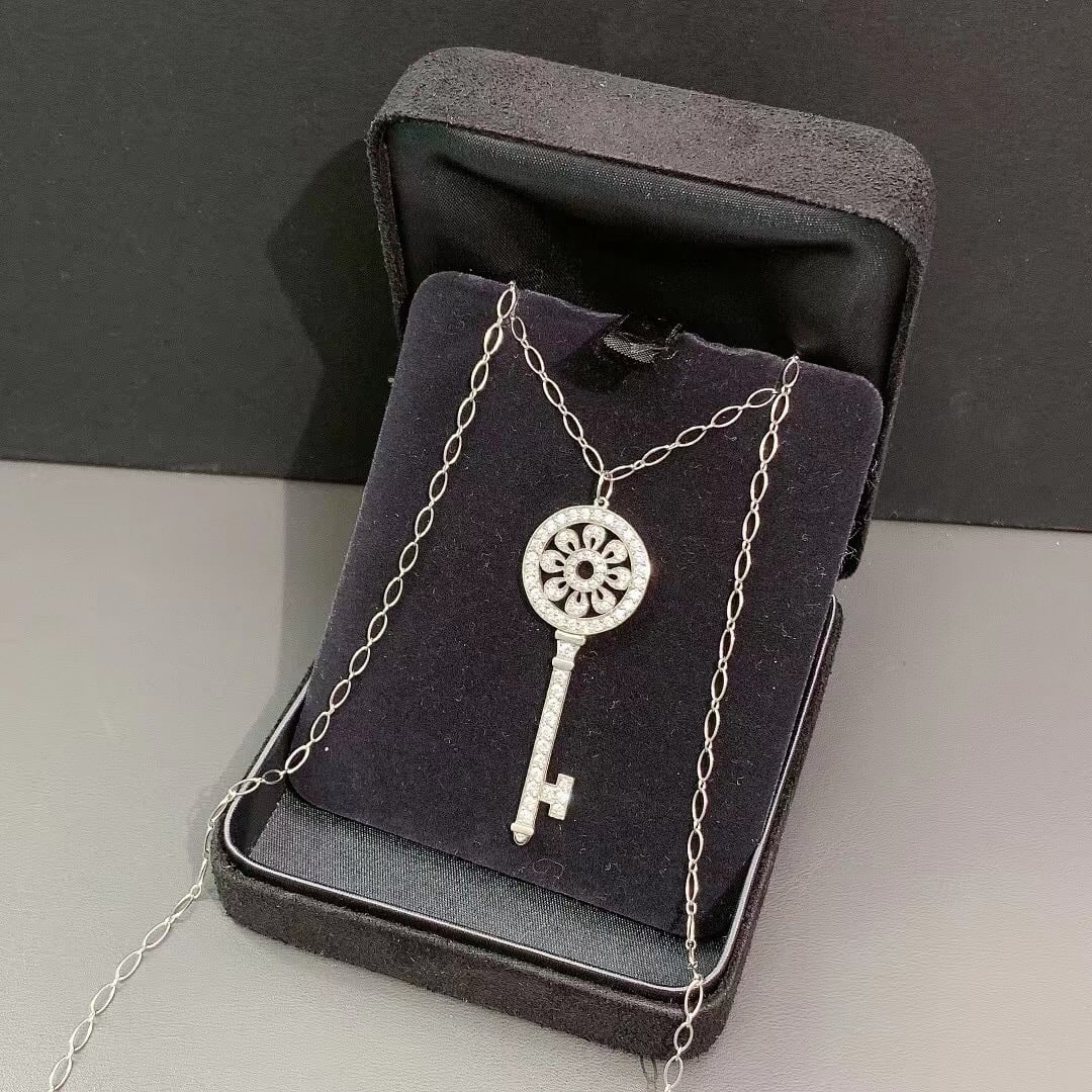 Tiffany & Co. Petals Key Pendant Brilliant-cut Diamonds Platinum: Tiffany Keys Petals Key Pendant by Tiffany & Co.. It is part of the iconic Tiffany Keys collection, which features symbols described as radiant beacons of optimism and hope.Key Product DetailsDesign: 