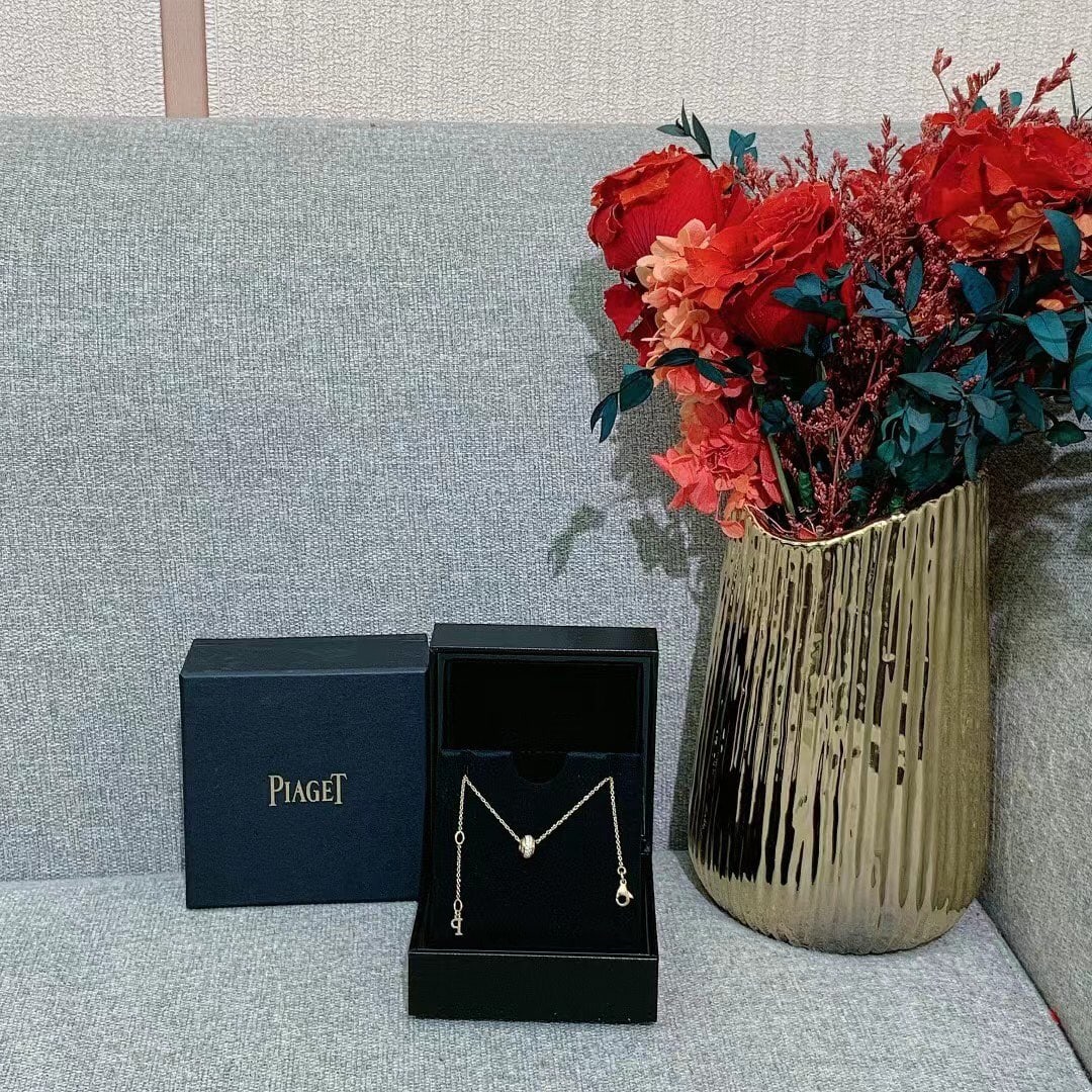 Piaget Pave Diamonds 18kt rRose Gold Possession Pendant Necklace: Possession pendant necklace by Piaget, a signature design recognized for its interactive "turning" elements.The pendant features a central band that spins freely, a hallmark of the Possession collecti