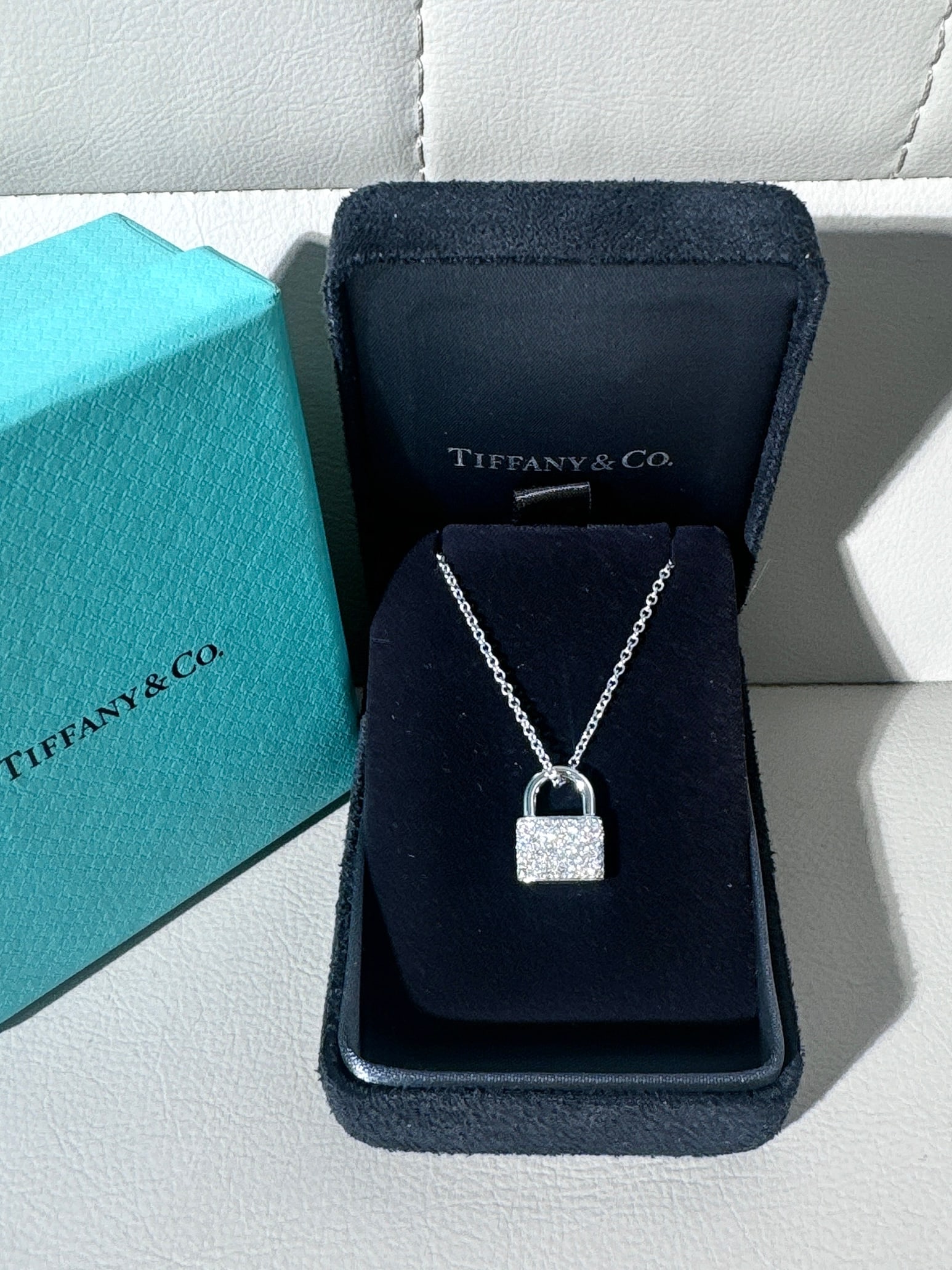 Tiffany Lock Pendant 18K White Gold Pave Diamonds Women Pendant: Inspired by a padlock design from the Tiffany Archives dating back to 1883, the Tiffany Lock collection represents love's enduring protection. The pendant features hand-set round brilliant diamonds on