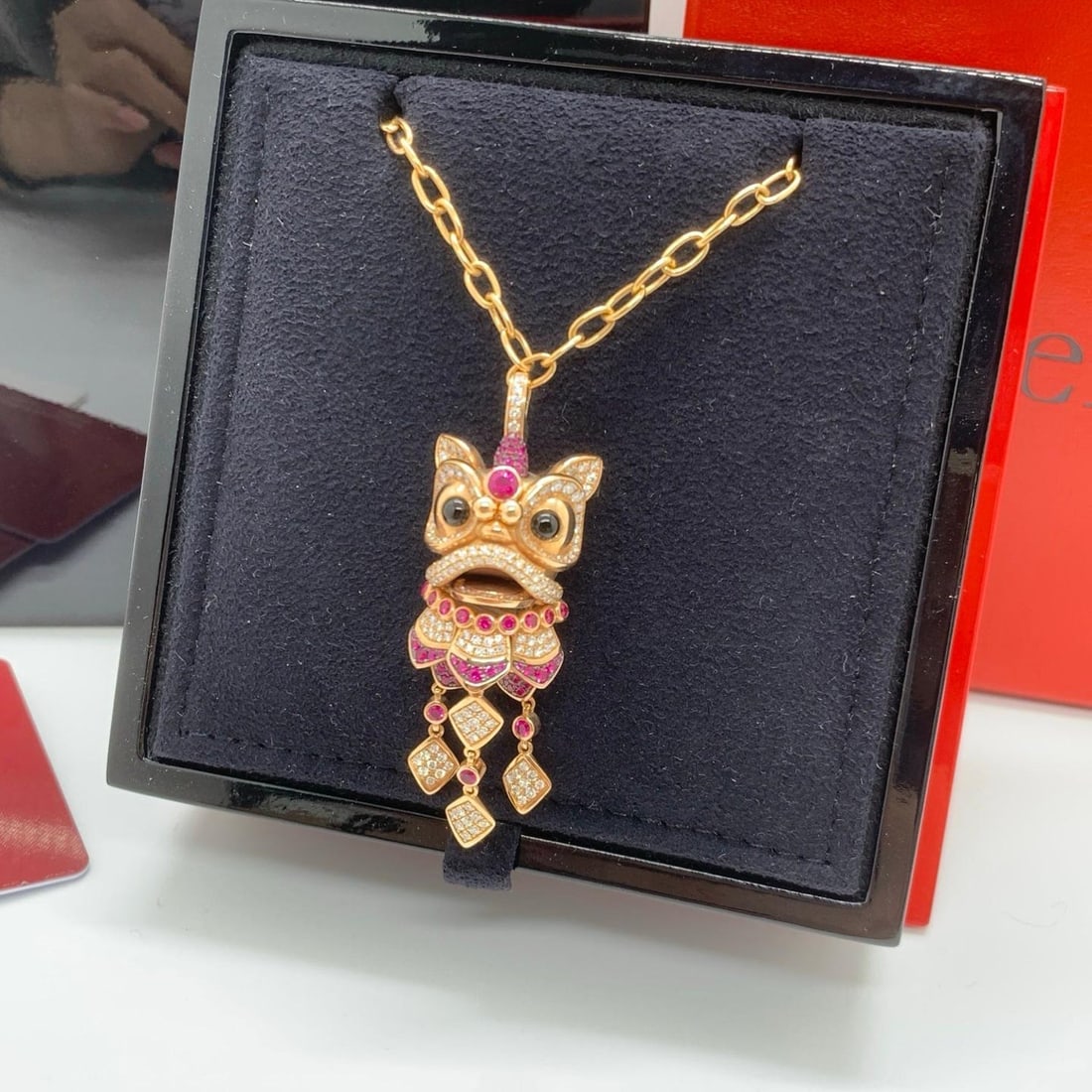 Qeelin Xi Xi Articulated Lion Dance 18K Rose Gold Ruby & Diamond Pendant Necklac: Creator: QeelinDimensions: Length: 46.5 in (1,181.1 mm)Period: 2010-Condition: Good. In original box.A spectacular and highly collectible authentic Qeelin pendant necklace from the iconic Xi Xi collec
