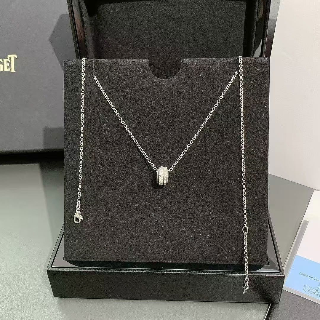 Piaget Possession pendant necklace 18K white gold pave-set brilliant-cut diamond: The Possession line is famous for its "turning band" concept, symbolizing a world in motion and the power of individual transformation.Materials: This specific version is crafted from 18K white gold a