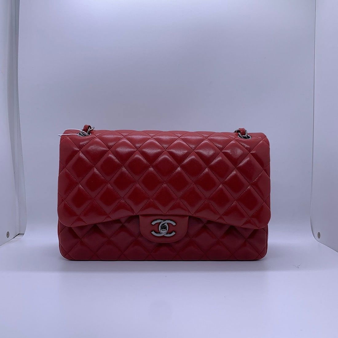 Chanel Classic Jumbo Double Flap Bag Red Leather Silver HW France: Normal signs of use, wear on the four corners, stains on the surface, scratches on hardware, wear on the chain, and scratches on both exterior and interior.