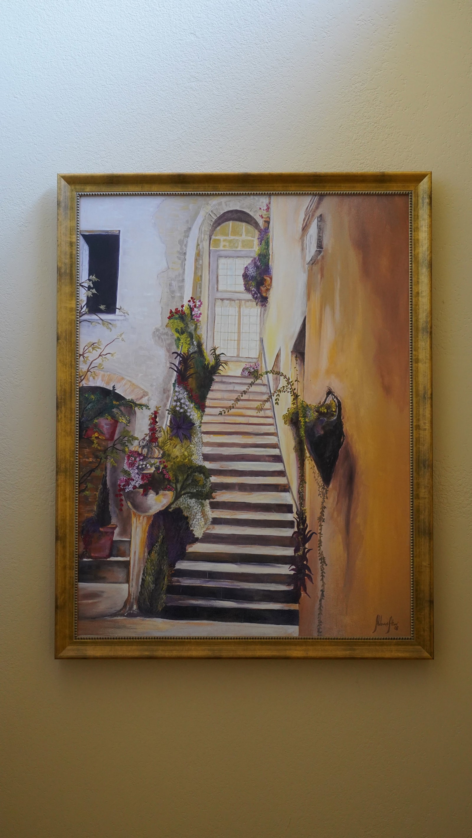Abbas Atwi Mediterranean Courtyard Stairway Scene Oil Painting, 1983: Large framed Mediterranean architectural courtyard scene featuring floral arrangements and a sunlit stairway. Signed lower right Abbas Atwi and dated 1983. Warm earth-tone palette with strong depth an