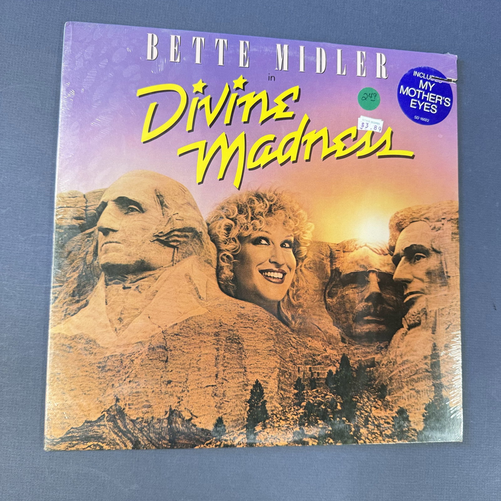 Sealed Vinyl Record Bette Midler Divine Madness: Overall good -sealed - with some minor damage on the cover.