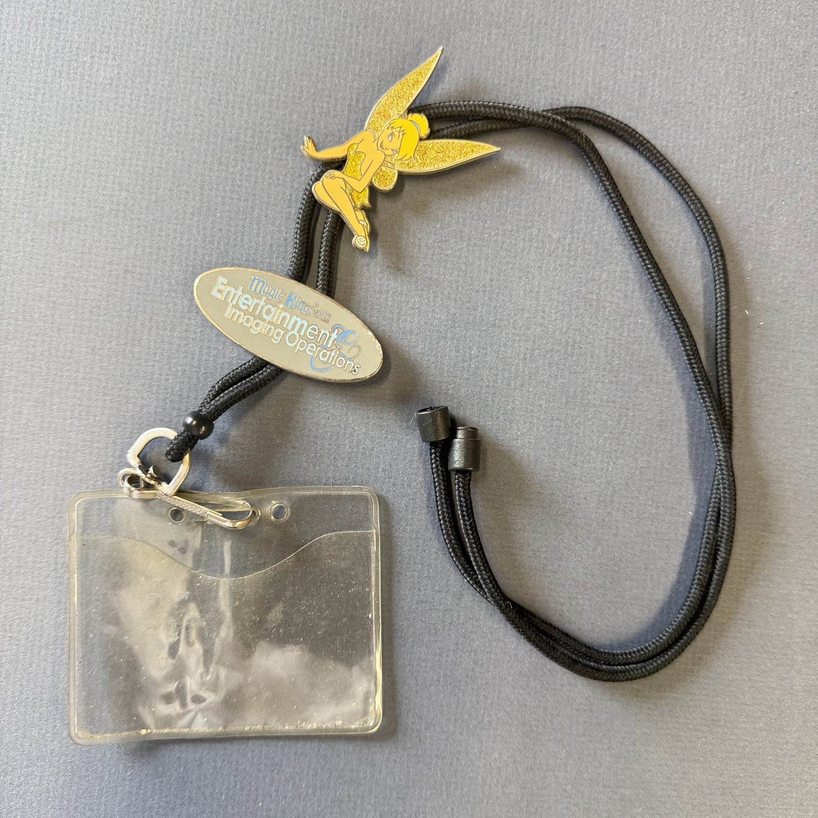 Old Disney Tinkerbell Cast Member Lanyard: With wear from use on the scene of Disney World. It arrived via a retired Cast memebr.