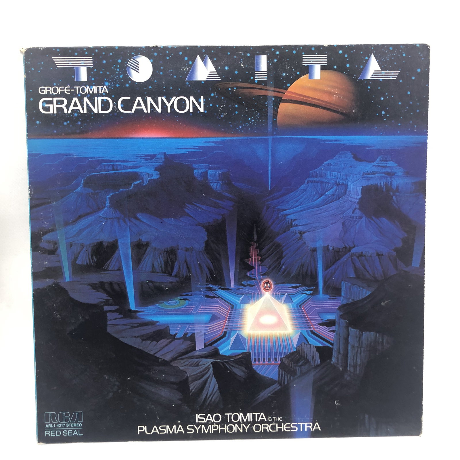 Vinyl Record Tomita Grande Canyon Electronic Music: Overall good - Vinyl: good - Cover: good - has been cleaned - Ships in a standard LP box with plastic sleeve - Combined shipping: y
