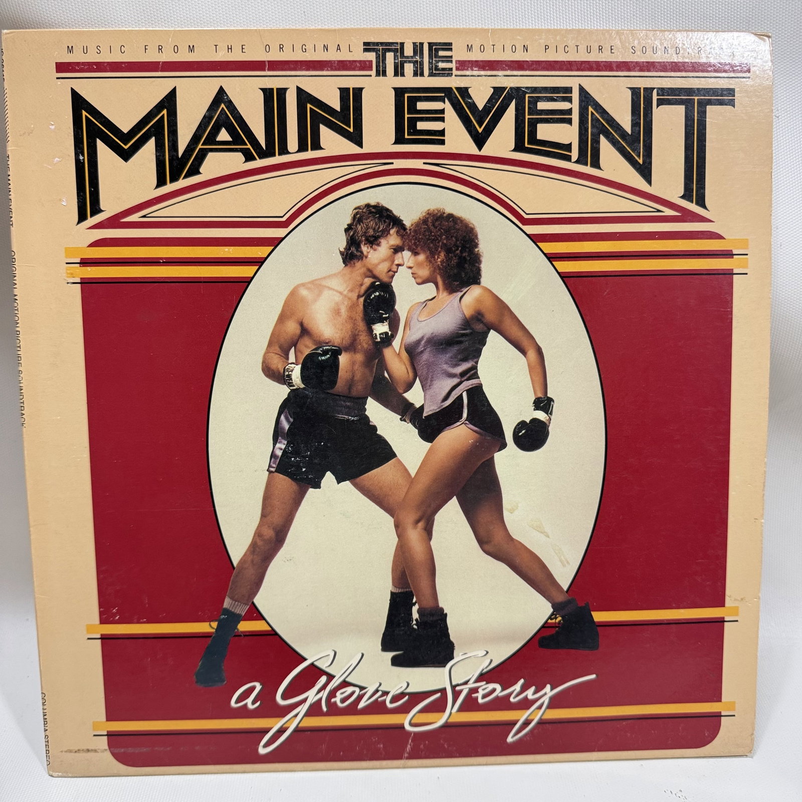 Vinyl Record The Main Event Soundtrack: Overall good - Vinyl: good - Cover: good - has been cleaned - Ships in a standard LP box with plastic sleeve - Combined shipping: y