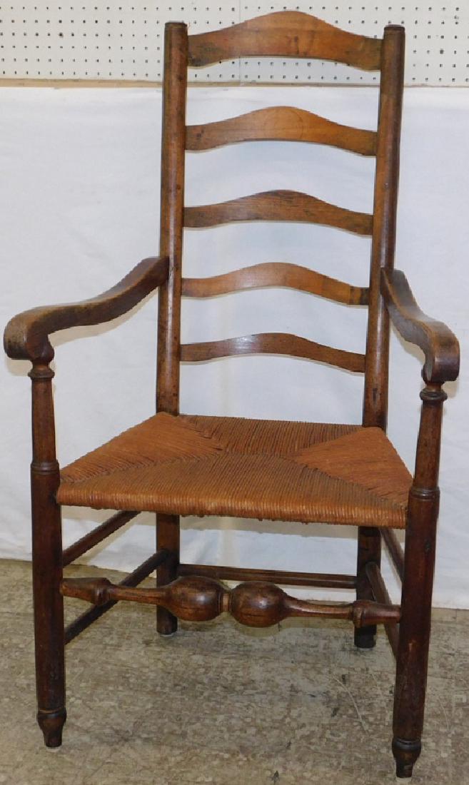 Primitive 5 slat ladder back rush seat armchair. (1 of 1)