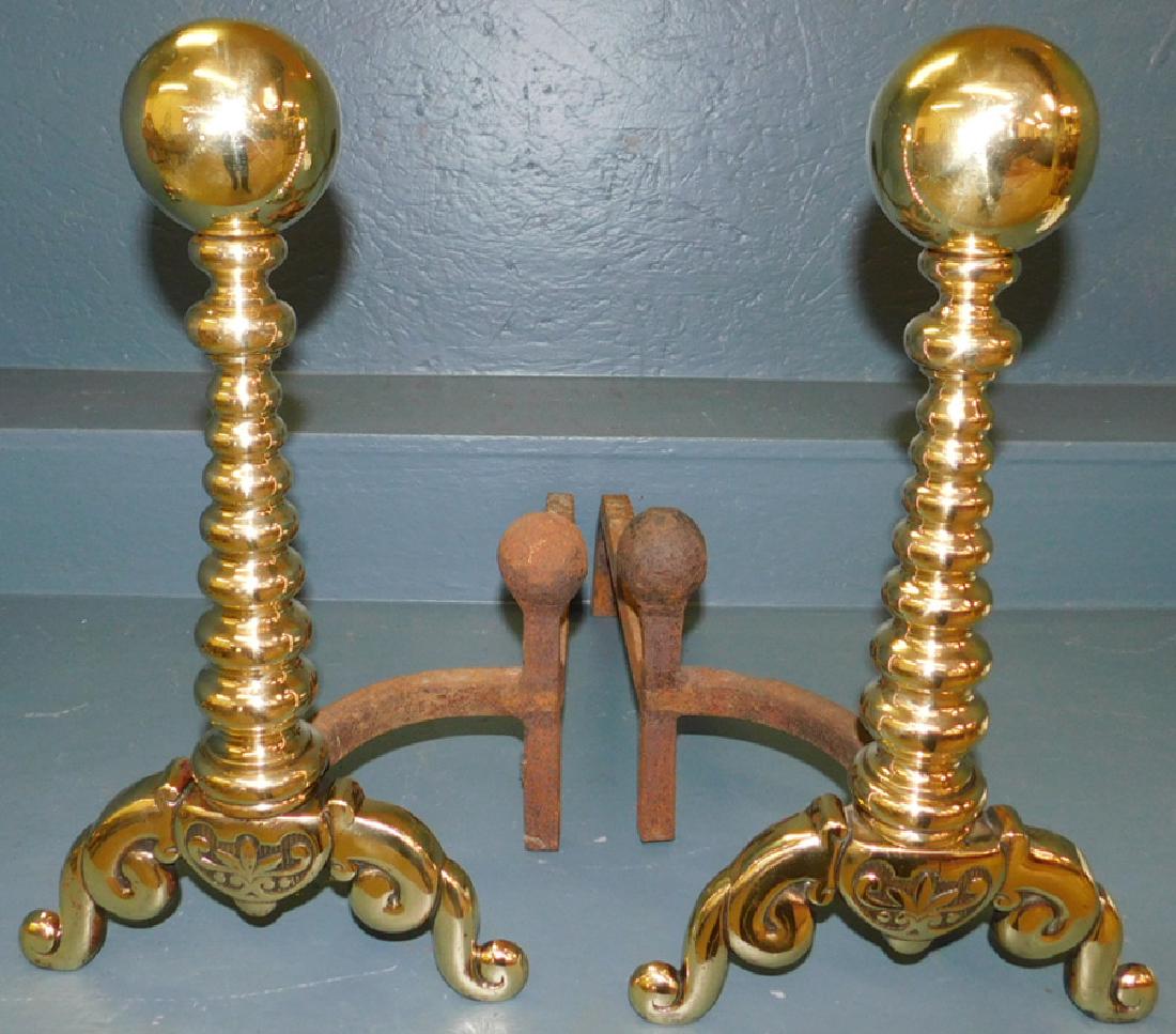Pair of brass polished cannonball andirons: Pair of brass polished cannonball andirons