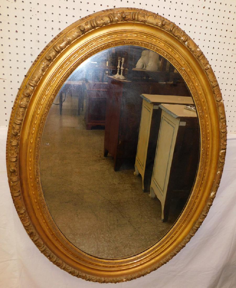 Oval gold leaf framed mirror. 36" x 56" tall. (1 of 2)