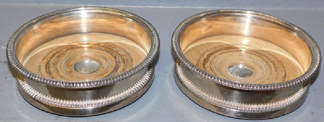 Pr 19th C Sheffield wine coasters w/armorial crests.: Pair 19th C Sheffield wine coasters w/armorial crests. 6" dia.