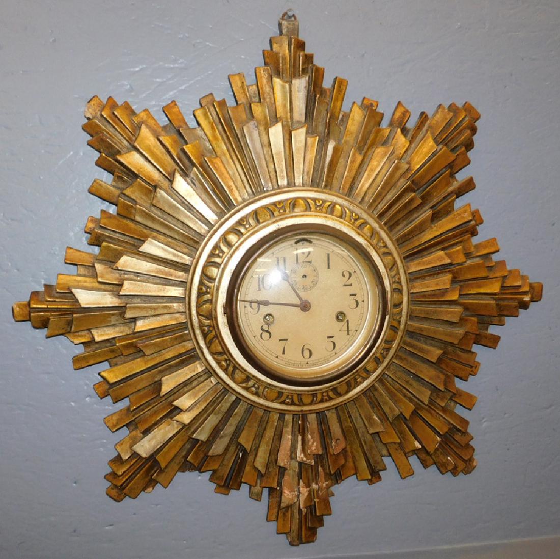Seth Thomas gesso framed sunburst wall clock.: Seth Thomas gesso framed sunburst round wall clock. 22" dia.