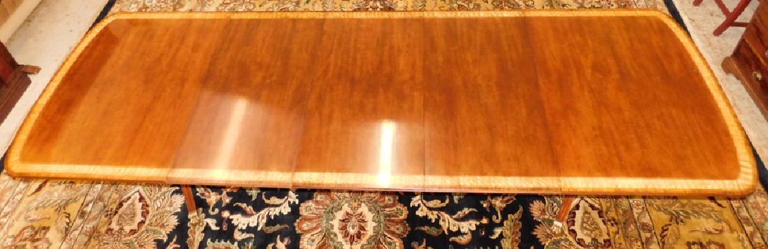 Banded top double pedestal table with 3 leaves.: Banded top mahogany double pedestal table with 3 leaves by Henredon. 134" long x 45" wide x 28" tall.