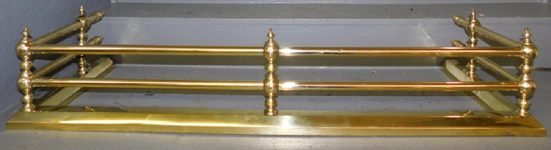 Polished brass tubular fireplace fender.: Polished brass tubular fireplace fender. 40 1/2" long.