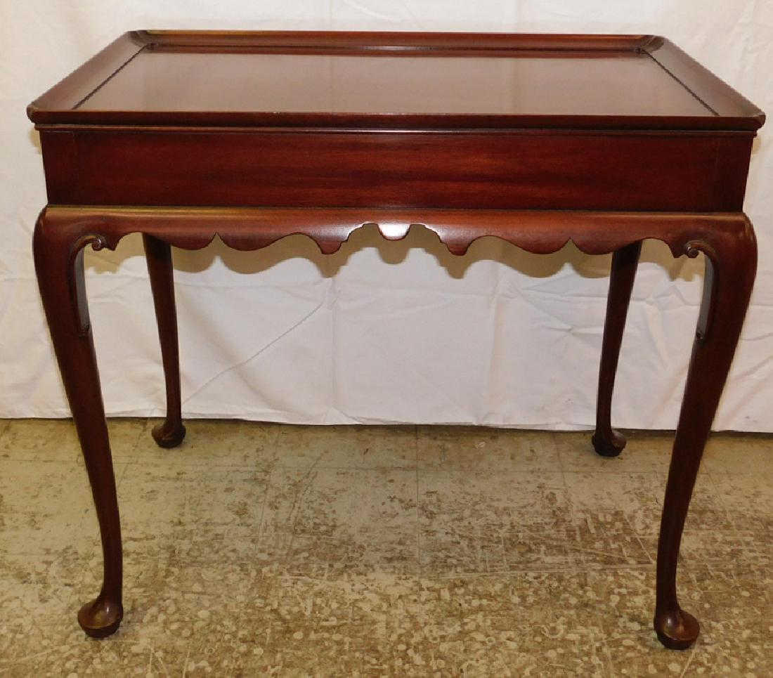 CW Kittinger mahogany tea table with candle slides.: CW Kittinger mahogany tea table with candle slides. 49 1/4" deep x 18" wide x 27" tall.