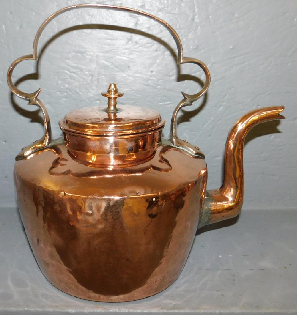 19th C Polished copper tea kettle: 19th century Polished copper tea kettle 12" tall.