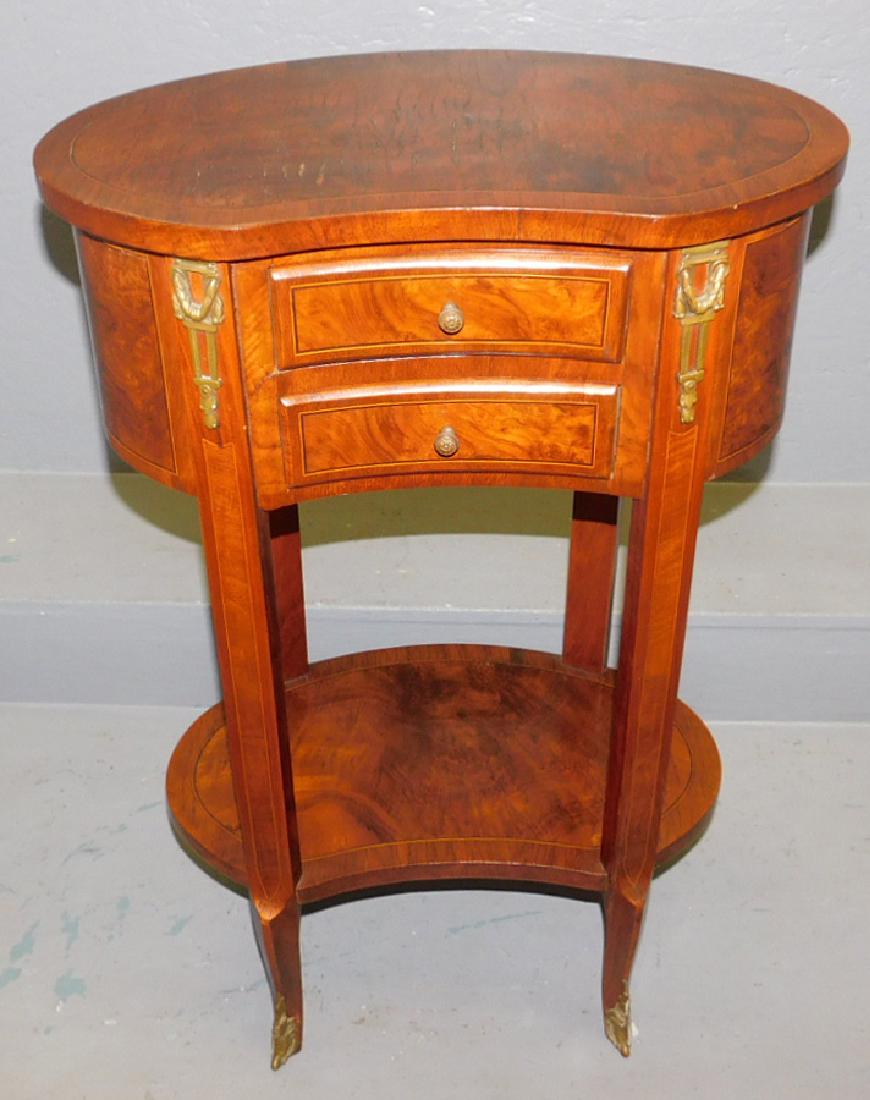 19th C French mahog turtle top two drawer stand: 19th century French mahogany kidney shaped two drawer stand with ormolu mounts. 19 1/2" wide x 11" deep x 30" tall.