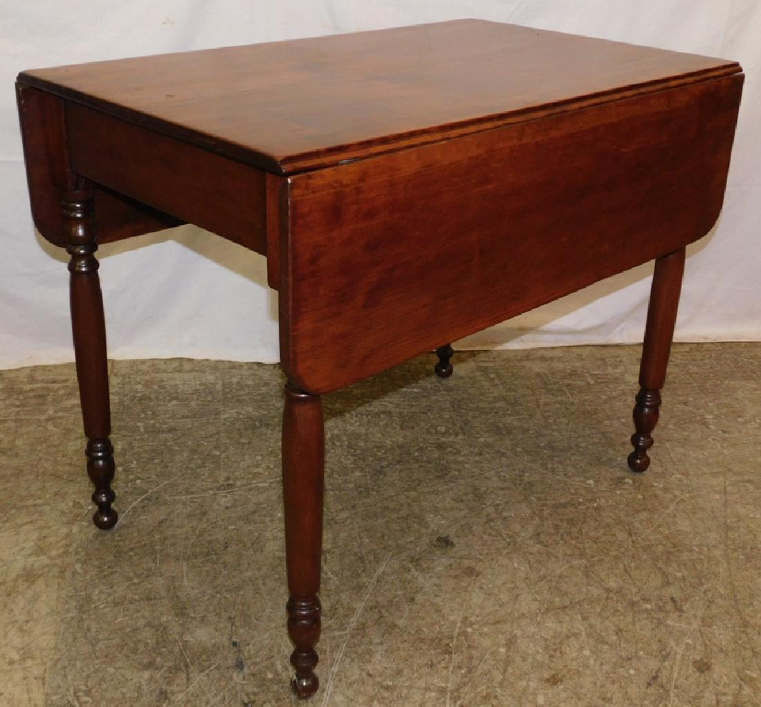 19th C cherry drop leaf table: 19th century cherry drop leaf table from the Whitaker estate. 44" wide x 36" deep x 29 12" tall.