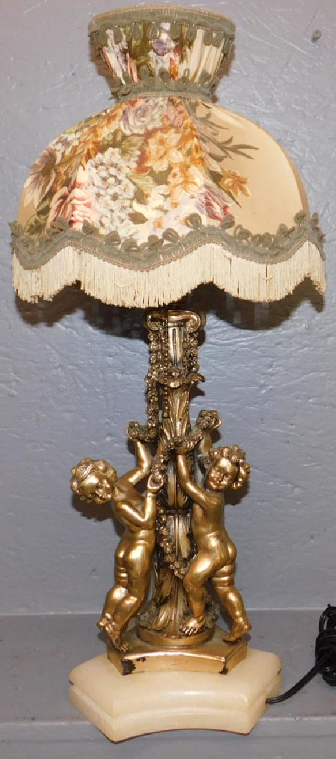 Signed  cherub lamp on onyx base. (1 of 3)