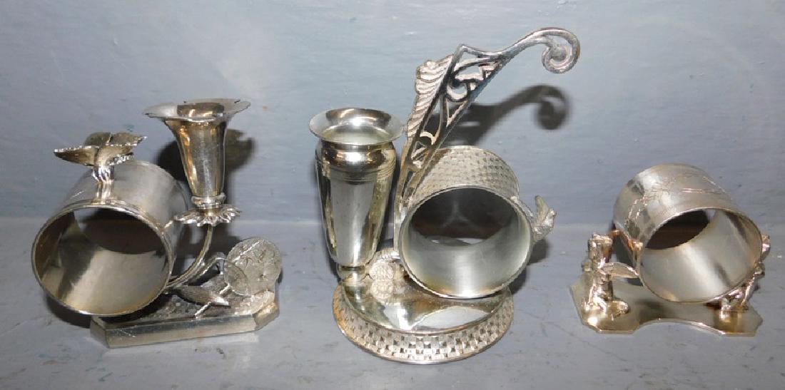 3 Assorted figural silver plate napkin rings. (1 of 1)