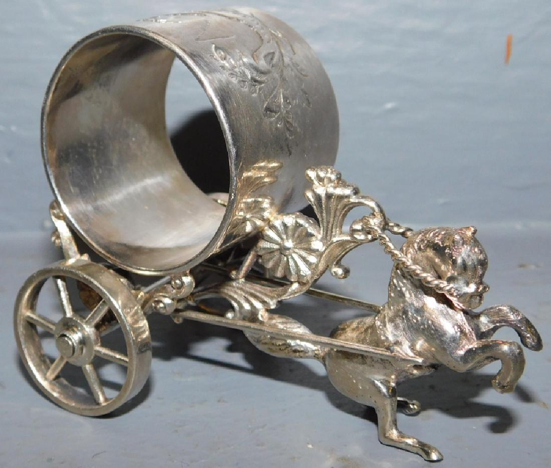 Meridian & Company s.p. mech. napkin ring.: Meridian and Company silver plate mechanical figural napkin ring. 3 1/2" long.