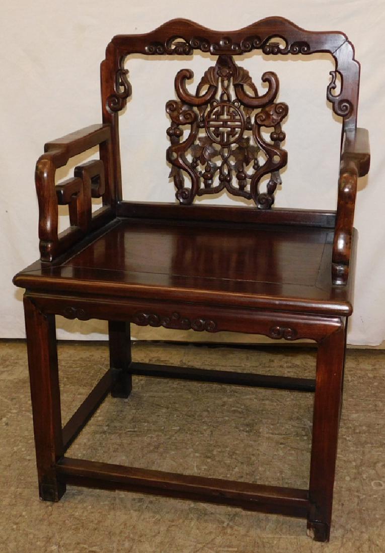 Carved Chinese stretcher base arm chair. (1 of 4)
