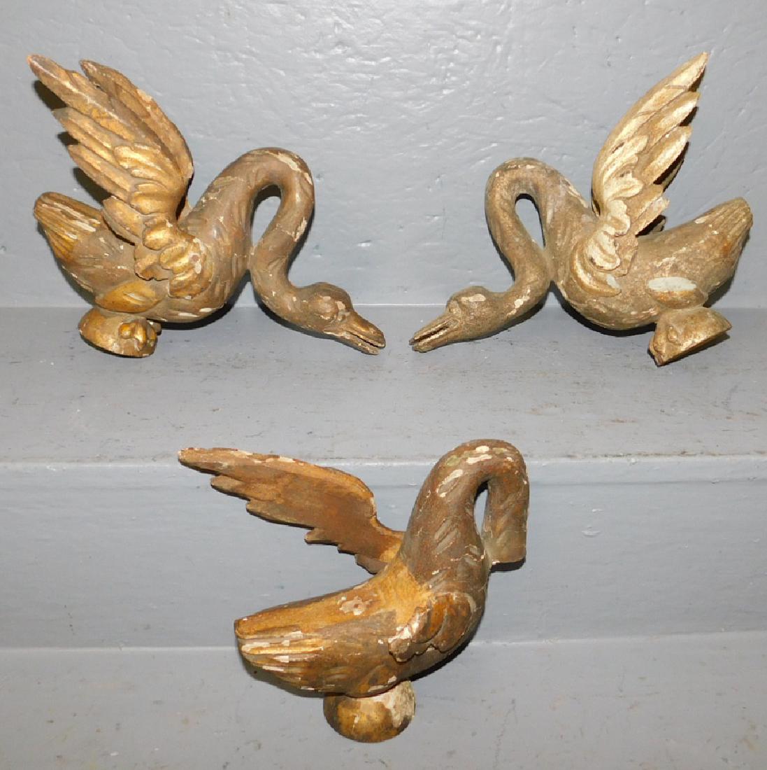 Pair and an odd carved wood goose figure. (1 of 1)