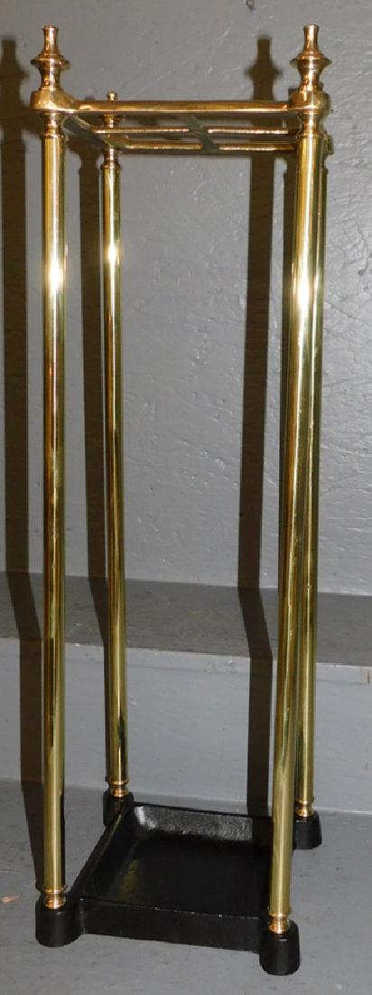 Polished brass and iron umbrella stand. 25" tall.: Polished brass and iron umbrella stand. 25" tall.