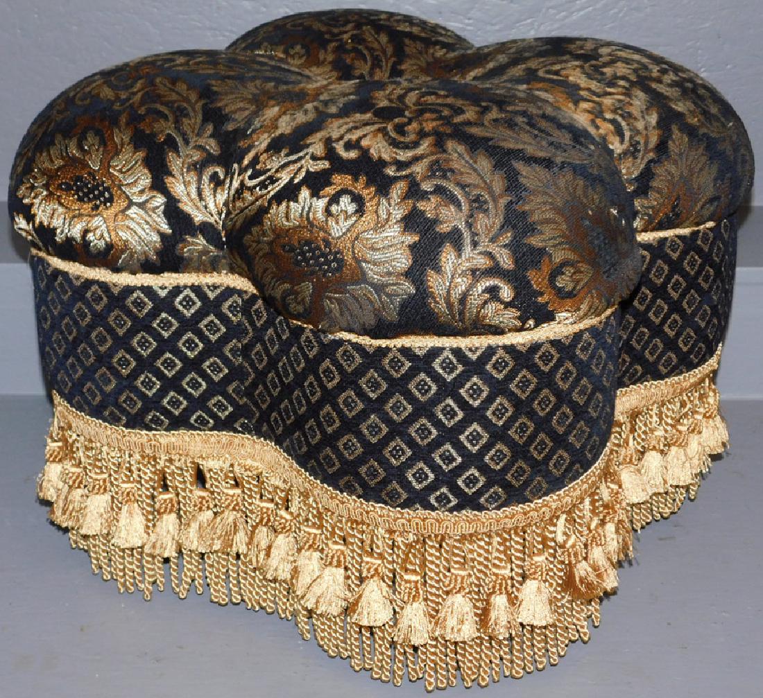 Black & gold upholstered pouf ottoman.: Black and gold upholstered pouf ottoman. 21" diameter x 15" tall.