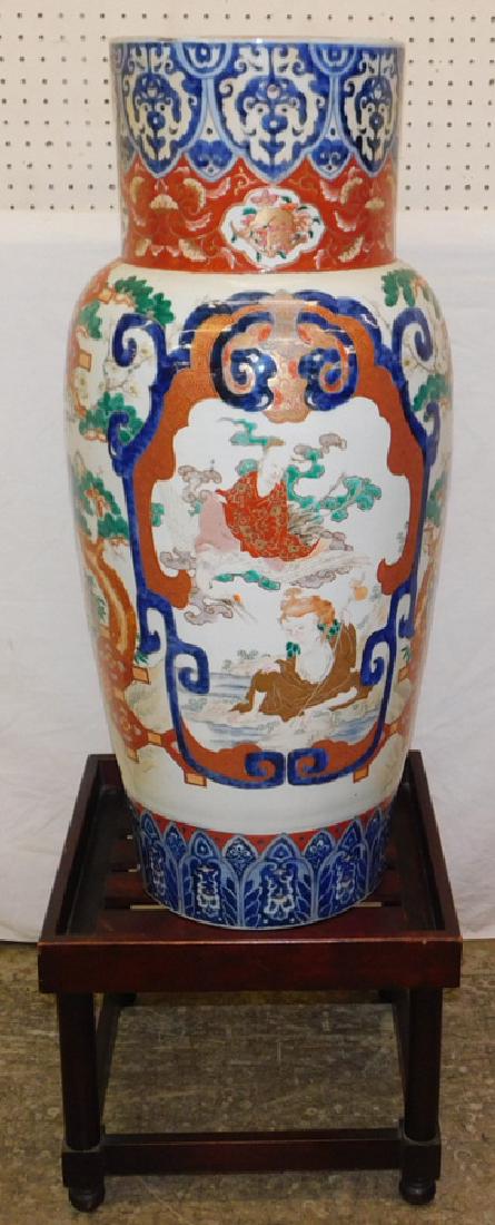 19th C Imari palace vase with stand.: 19th century Imari palace vase with stand. Restored. Vase is 38" tall.