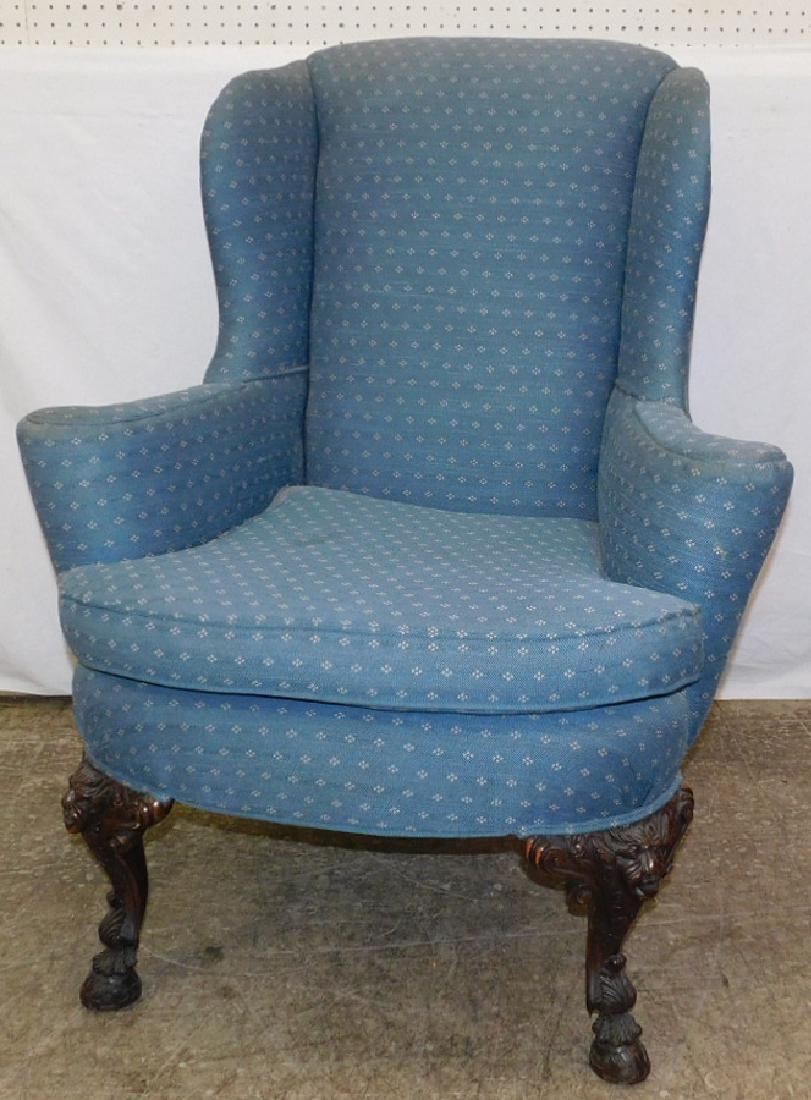 Carved base Gothic type wing chair.: Carved base Gothic type wing chair. 43" tall.