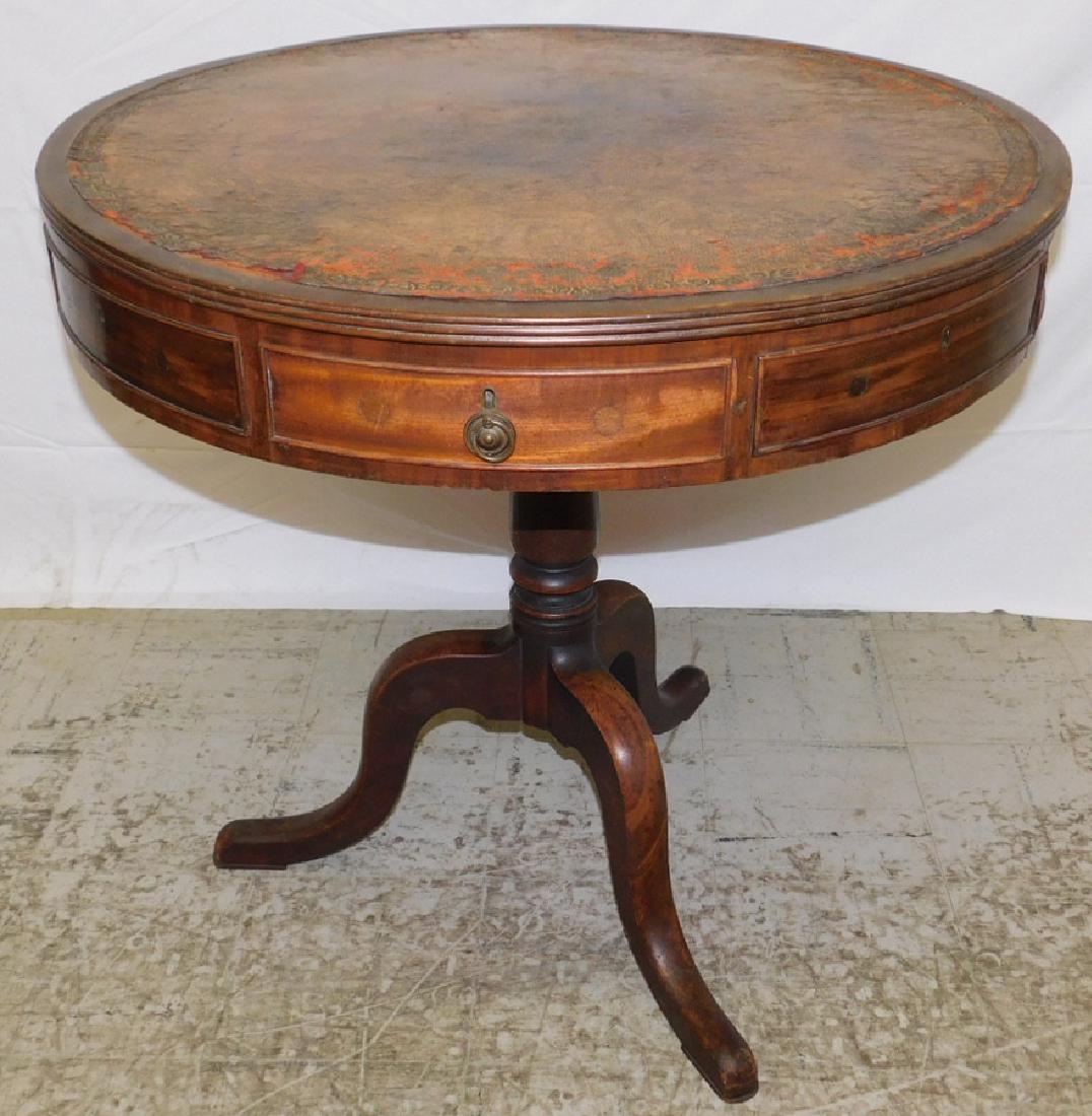 Antique tooled leather top drum table.