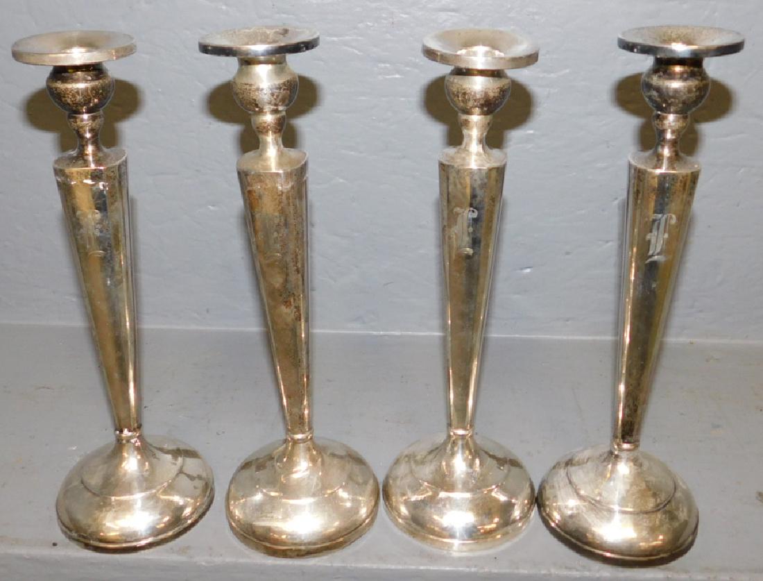 Set of 4 sterling weighted candlesticks. (1 of 1)
