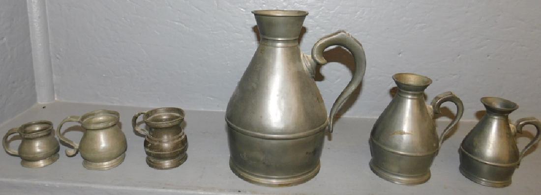 6 antique pewter measures. (1 of 5)