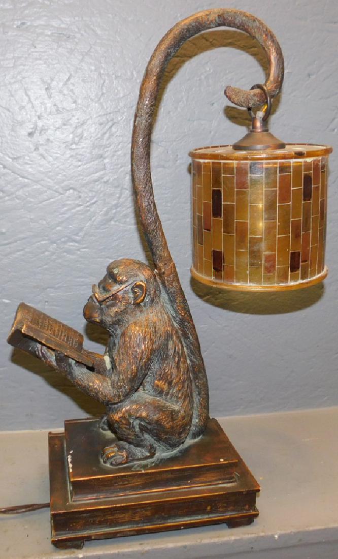 Figural monkey lamp with faux mica shade.