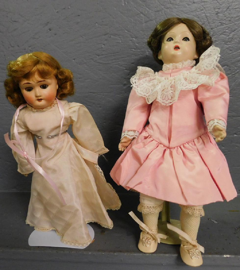 2 antique composition dolls with glass eyes. (1 of 3)