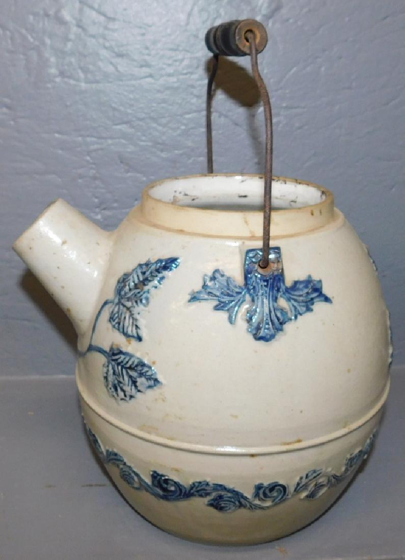 Salt glazed hot water kettle with missing top: Salt glazed hot water kettle with missing top. 8" tall.