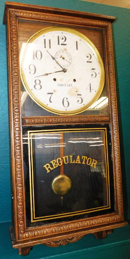 Oak 30 Day Regulator Wall Clock: Oak 30 Day Regulator Wall Clock. 16 1/4" X 33 1/2"
