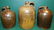 Three Early Stoneware Whiskey Jugs