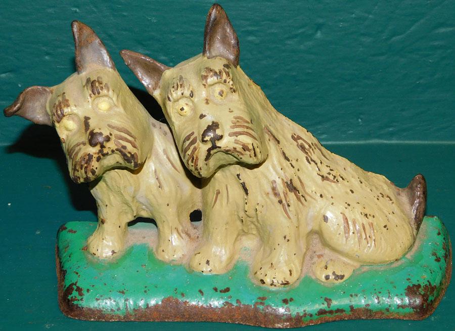 Vintage Cast Iron Painted Doorstop of Scottish Terriers: Vintage Cast Iron Painted Doorstop of Scottish Terriers.