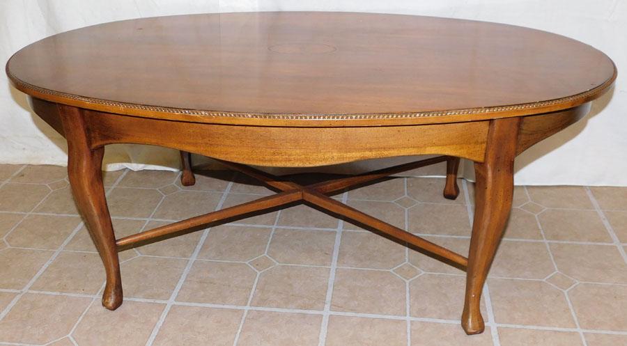 Mahogany Inlaid Oval Coffee Table: Mahogany Inlaid Oval Coffee Table. 43 3/4" W 27 3/4" D 17 1/4" H