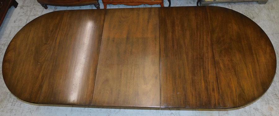 Round Mahogany Kittinger Table with 3 Leaves: Round Mahogany Dining Table with 3 Leaves by Kittinger. 109 1/2" L 44" W 30 1/2" H