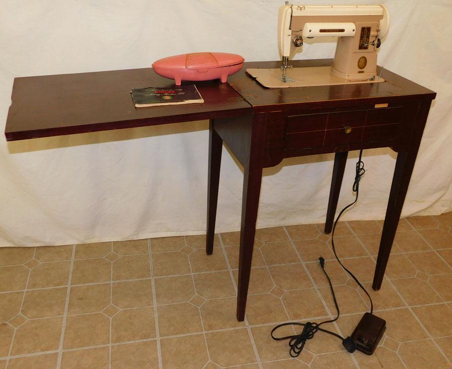 Singer Sewing Machine in Mahogany Stand: Singer Sewing Machine in Mahogany Stand . 23 1/2" W 16 1/2" D 32" H