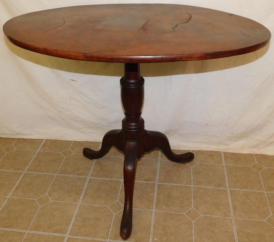 Oval Top Burl Mahogany Tilt Top Table: Oval Top Burl Mahogany Tilt Top Table. 33" W 21 1/2" D 27" H