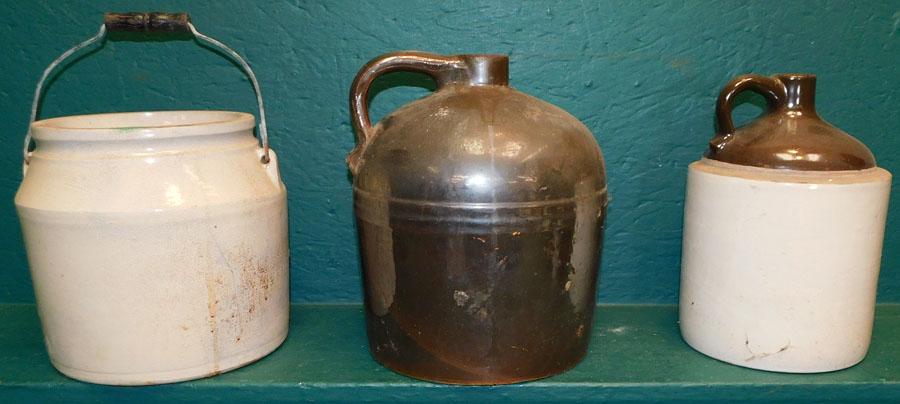 Two Stoneware Whiskey Jugs and one crock: Two Stoneware Whiskey Jugs and one crock. 11 1/2" H (Tallest)