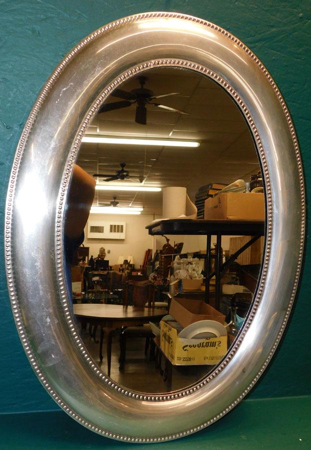 Metal Framed Oval Mirror: Metal Framed Oval Mirror. 24" X 17 3/4"