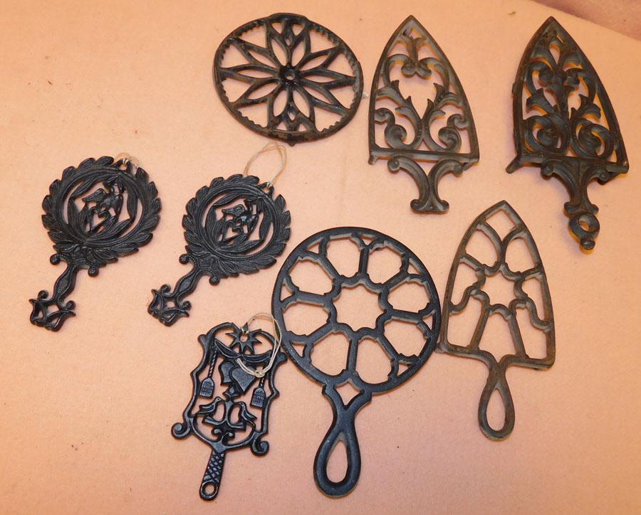 Lot Of Cast Iron Trivets: Lot Of Cast Iron Trivets.