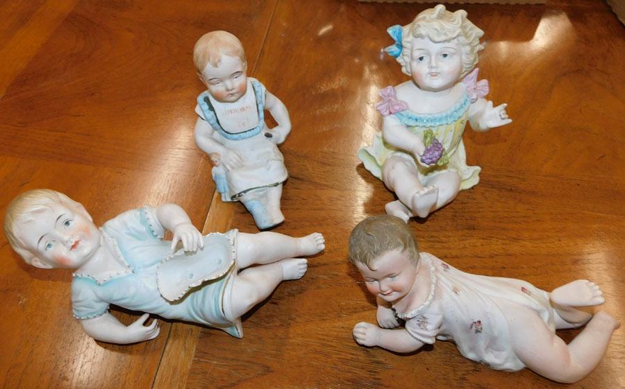 Lot of Porcelain Piano Babies: Lot of Porcelain Piano Babies.