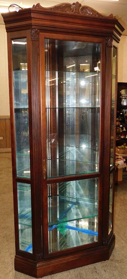 Cherry Carved Mirrored Back Corner Curio Cabinet: Cherry Carved Mirrored Back Corner Curio Cabinet By Howard Miller. 40 1/2" W 24" D 86 1/2" H