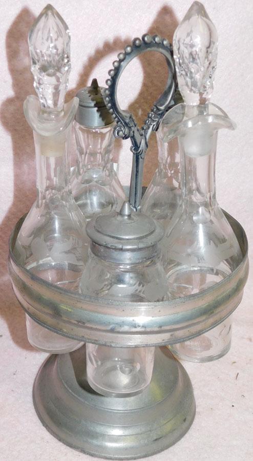 Glass Cruet Set In Silver Plate Stand: Glass Cruet Set In Silver Plate Stand. 11 1/2" H